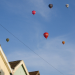 Balloons over houses CREDIT Visit-England